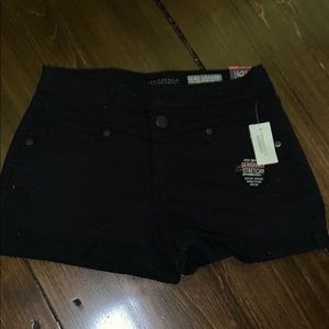 High waisted black shorts.